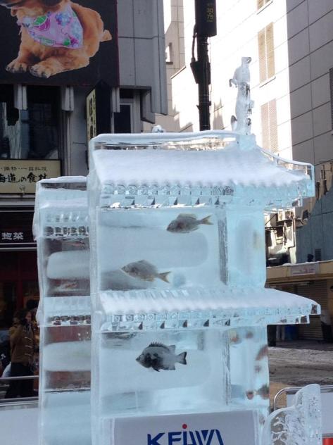 An ice sculpture displaying fish caught within the ice. Photo Courtesy of my friend Maria